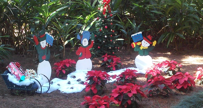 poinsettas and snowmen & women decorations at Celebrate the Holidays