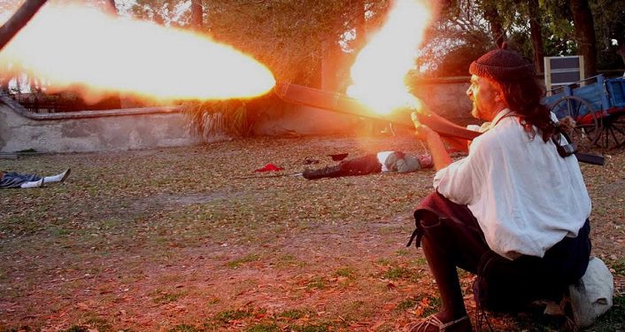 image of reenactor firing weapon during Drake's Raid & Encampment