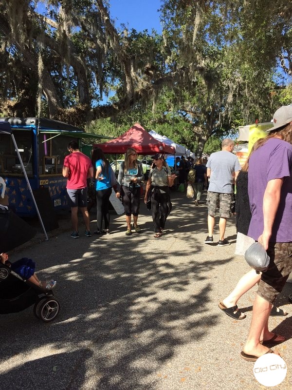 People walking under Oak Trees.