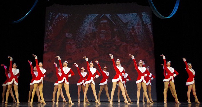 image of dancers on stage, dressed in red & white dance costumes for the St Augustine Winter Spectacular 2021