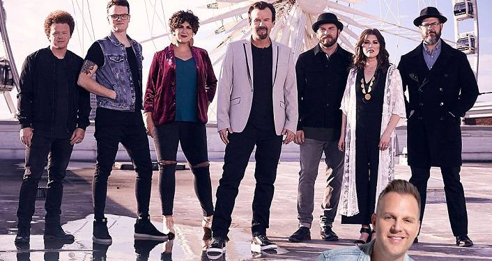 press photo Casting Crowns and Matthew West; image of 2 woman & 5 men standing with huge ferris wheel in the background. In the forefront is head-shot of man