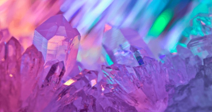 image of crystals with shades of pinks and purples reflected. Crystals & Meditation Online Workshop